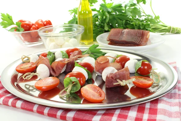 Fresh Tomato, mozzarella and ham skewers — Stock Photo, Image