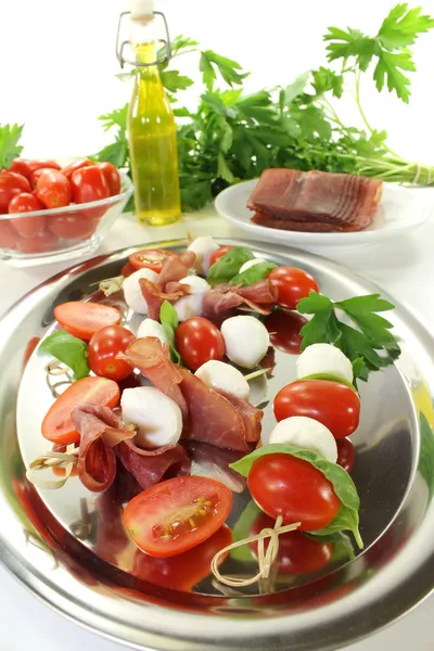 Tomato, mozzarella and ham skewers — Stock Photo, Image