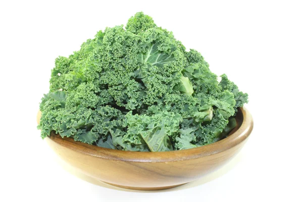 Kale in a wood bowl — Stock Photo, Image