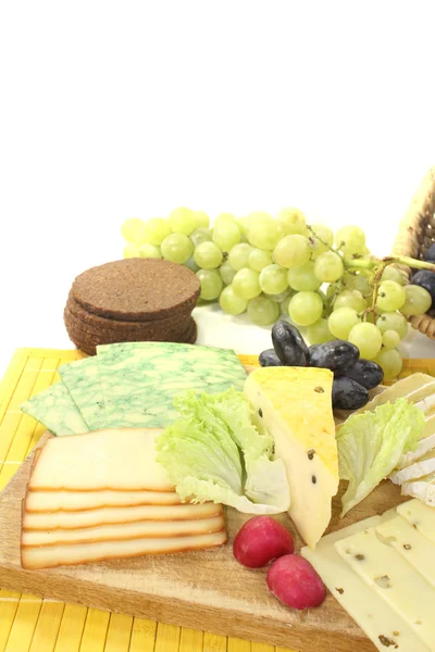 Slices of cheese with radishes — Stock Photo, Image