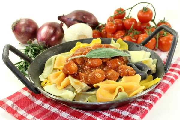 Pasta with sausage stew — Stock Photo, Image