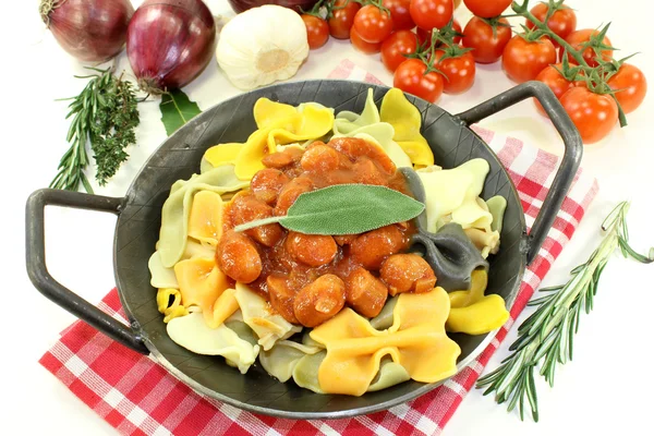 Pasta with sausage stew — Stock Photo, Image