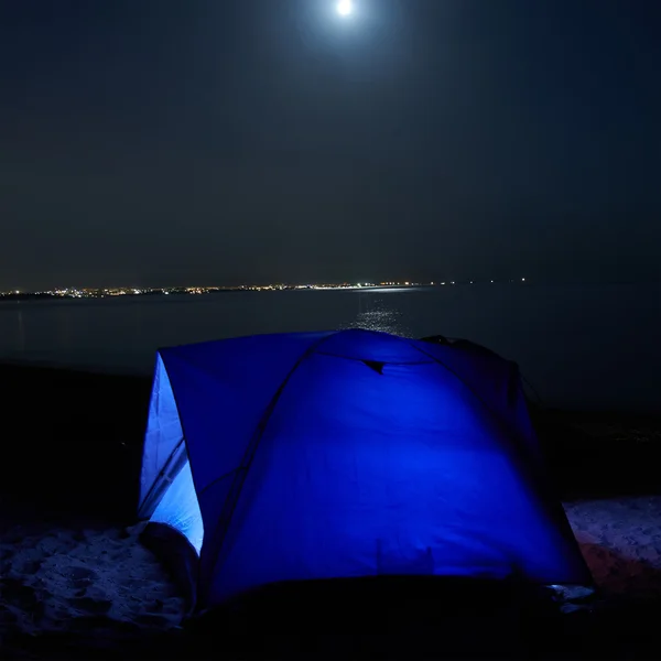 Blue illuminated tent at night — Stock Photo, Image