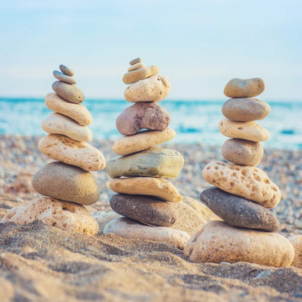 Three stacks of round smooth stones — Stock Photo, Image