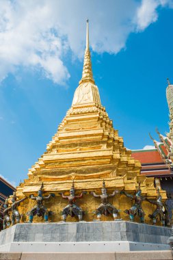 Panorama of complex of Temple of Emerald Buddha, view to ornate Royal Pantheon, gold chedi and stupas. Grand Palace, Bangkok, Thailand