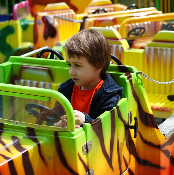 Boy is driving toy train — Stock Photo, Image