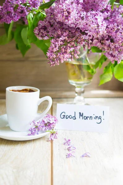 Lilac flowers and coffee — Stock Photo, Image