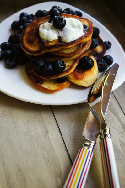 Thick pancakes with bilberries — Stock Photo, Image