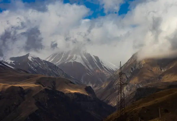Highest Mount Georgia Kazbegi Covered Clouds First Snow Slopes Late — Stockfoto