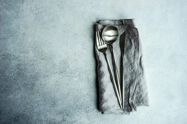 Modern Cutlery Set Grey Napkin Same Color Concrete Background — Foto de Stock