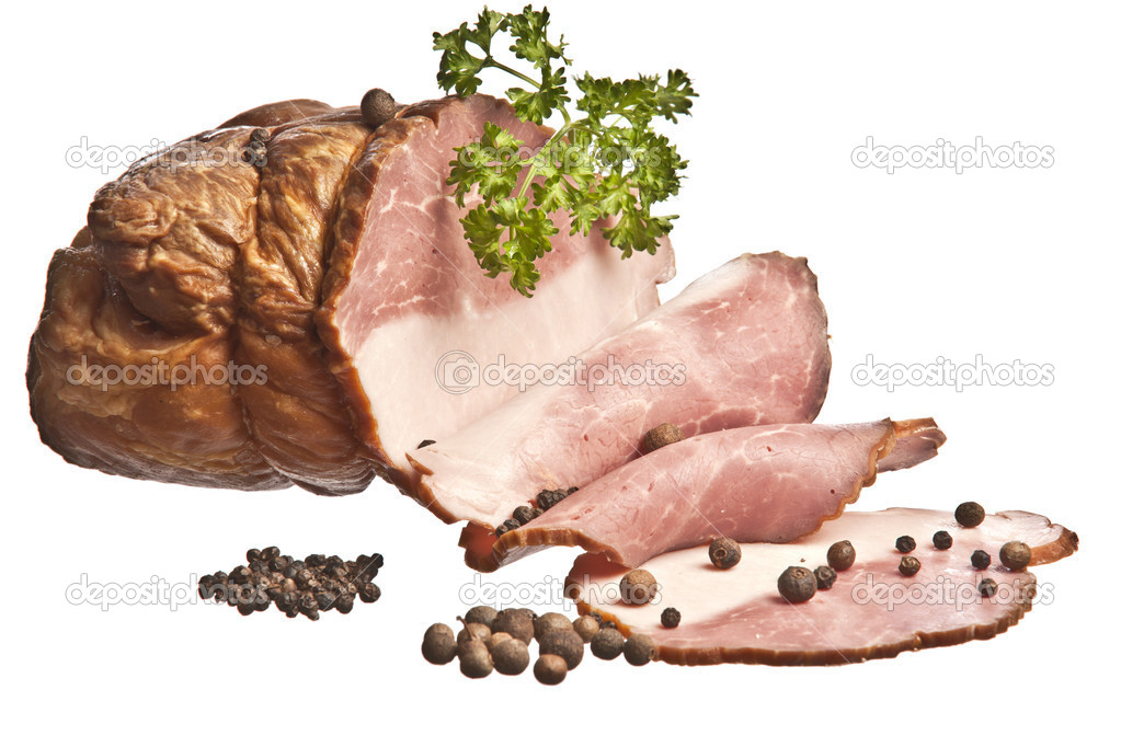 The boiled pork decorated by pepper and a parsley on a white bac