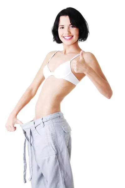 Young fit woman with big pants — Stock Photo, Image