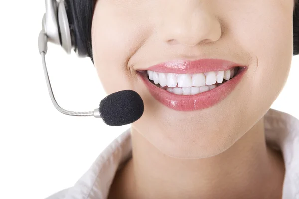 Young call-centre assistant smiling at the camera — Stock Photo, Image