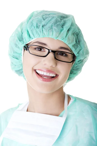 Doctor or nurse with mask and cap — Stock Photo, Image