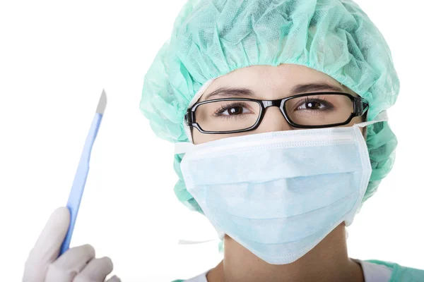 Doctor or nurse with mask and cap — Stock Photo, Image