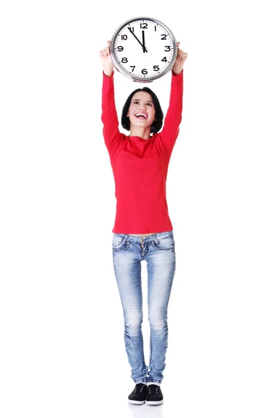 Happy young woman holding office clock — Stock Photo, Image