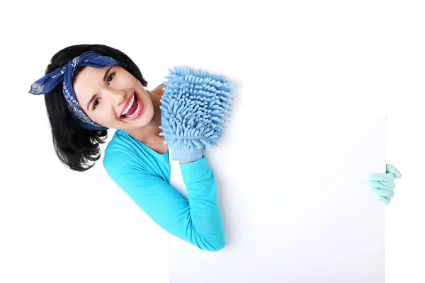 Cleaning woman showing blank sign board. — Stock Photo, Image