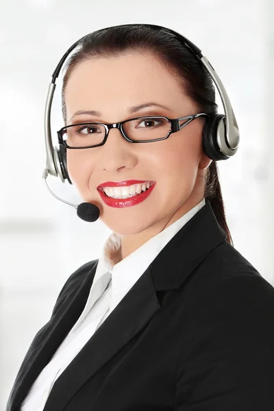 Lächelnde junge Frau mit Headset und Mikrofon. — Stockfoto