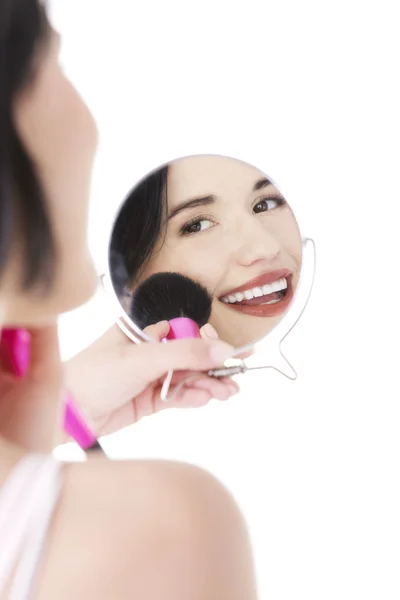 Woman doing make-up on face. — Stock Photo, Image