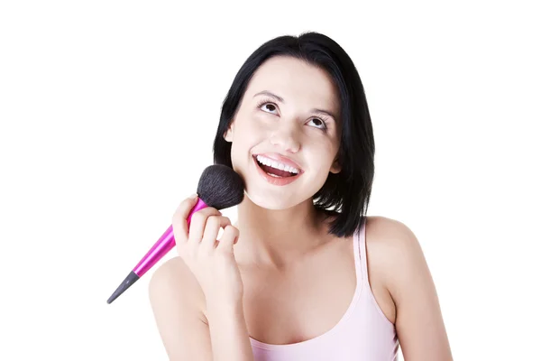 Mujer haciendo maquillaje en la cara . — Foto de Stock