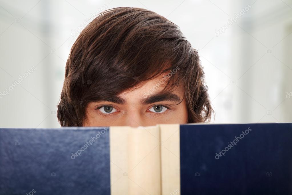 Teen man reading