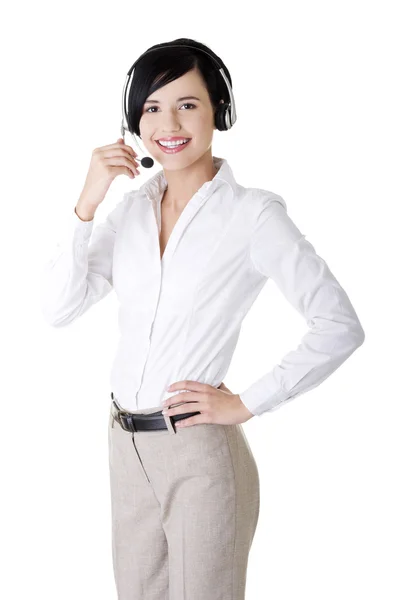 Bastante joven trabajador del centro de llamadas con un auricular —  Fotos de Stock