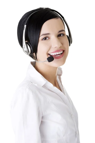 Bella giovane call center lavoratore indossa un auricolare — Foto Stock