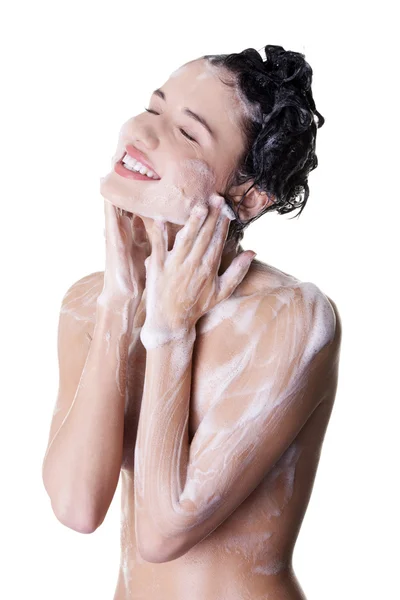 Young fit woman in shower — Stockfoto