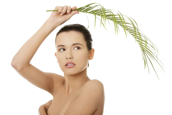 Young beautiful woman with green leaf — Stock Photo, Image