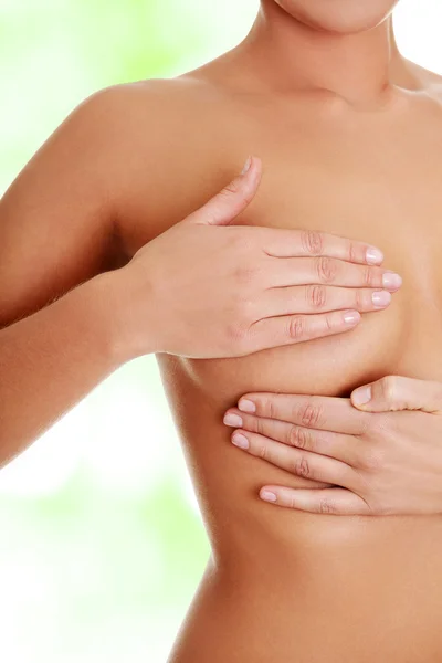 Woman examining her breast — Stock Photo, Image