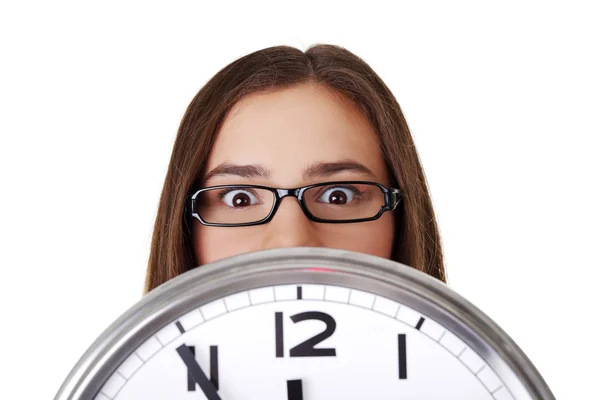 Young woman holding office clock — Stock Photo, Image