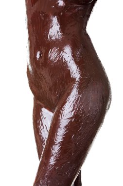 Naked female body covered with chocolate clipart