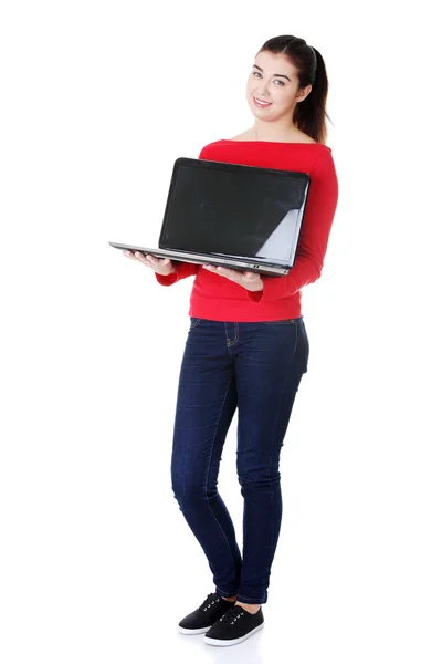 Woman holding 17 inch laptop — Stock Photo, Image