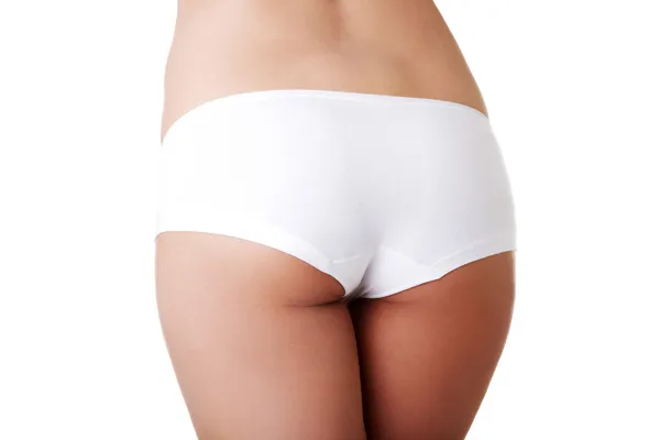 Slim tanned woman's butt. — Stock Photo, Image