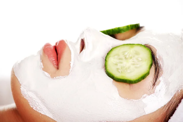 Young woman with cucumber slices on the face — Stock Photo, Image