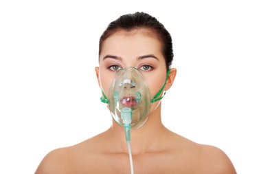 Diseased female patient wearing a oxygen mask clipart