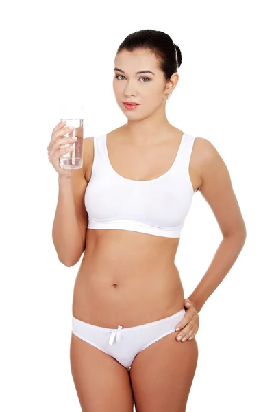 Mujer en ropa interior con vaso de agua mileral —  Fotos de Stock