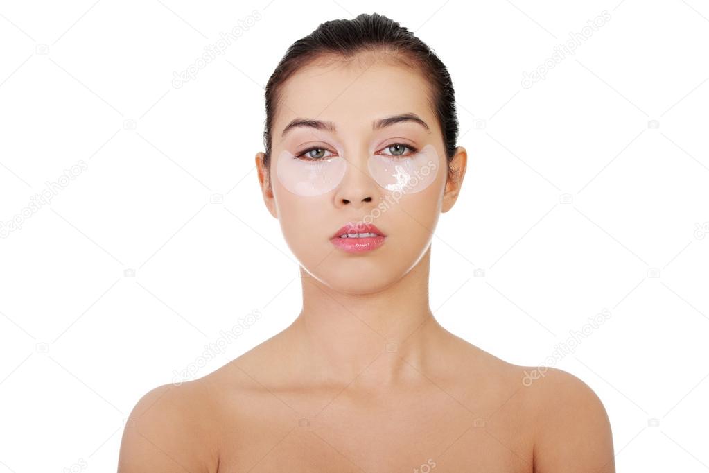 Woman with collagen eye lift mask