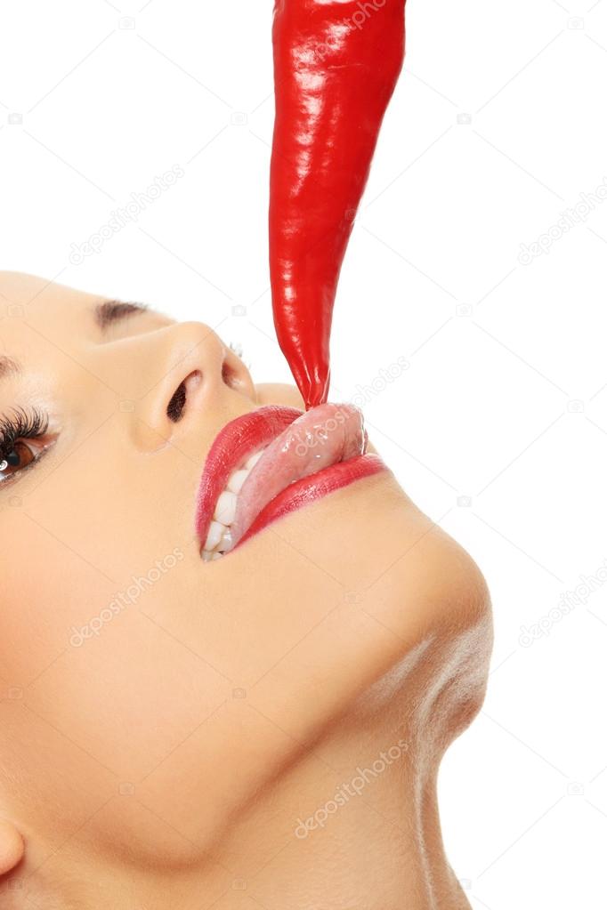 Beautiful woman lips with hot paprika
