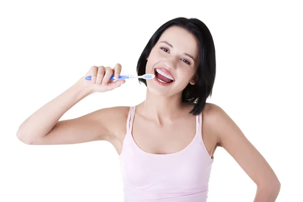 Woman with great teeth holding tooth brush — Stock Photo, Image