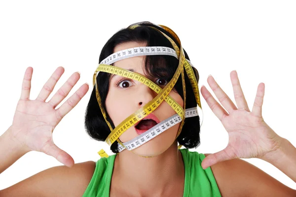 Woman with measuring tape around her head — Stock Photo, Image