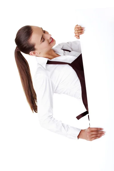 Mujer elegante en delantal sosteniendo tablero en blanco —  Fotos de Stock