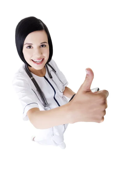 Young female doctor or nurse gesturing OK — Stock Photo, Image