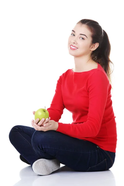 Pretty young student woman with green apple — Stock Photo, Image