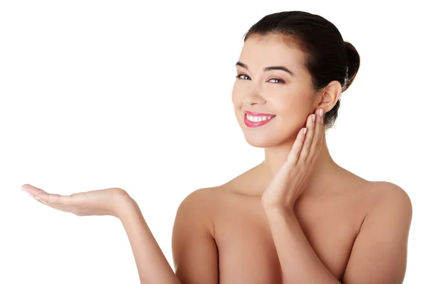 Woman presenting something on hand — Stock Photo, Image