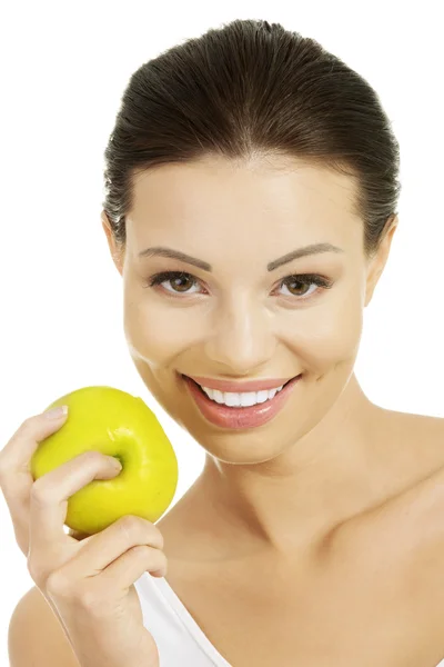 Beautiful woman holding green apple. — Stock Photo, Image