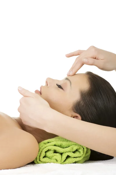 Beautiful relaxed woman enjoy receiving face massage — Stock Photo, Image