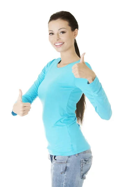 Beautiful young woman gesturing thumbs up. — Stock Photo, Image