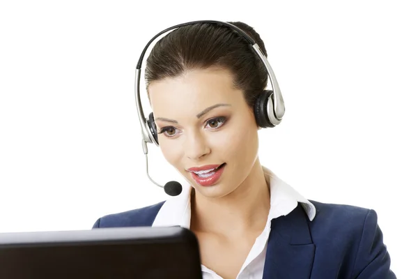 Beautiful young call-center assistant smiling — Stock Photo, Image
