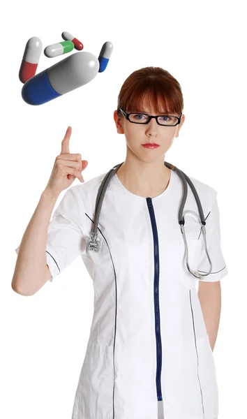 Atraktivní ženské doktor s prášky — Stock fotografie